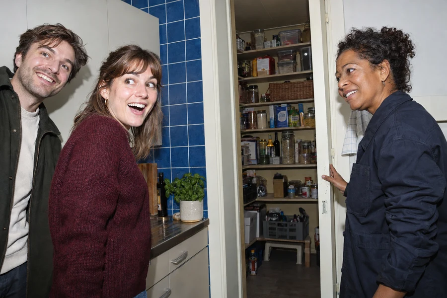 AI concept photo of excited buyers during a kitchen viewing.